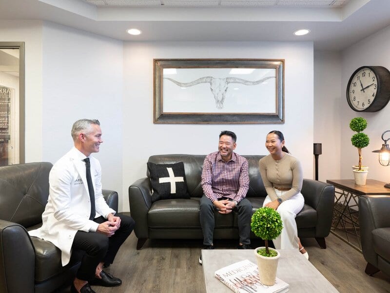 Dr. James Broadbent DO meeting with patients in comfortable lounge