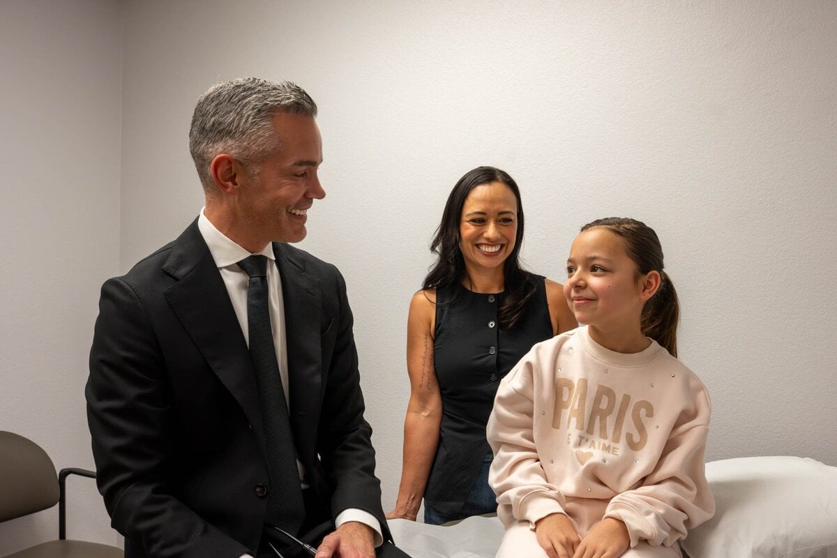 Dr. Ryon Parker MD MBA with mother and daughter during pediatric visit at Parker Medical Las Vegas